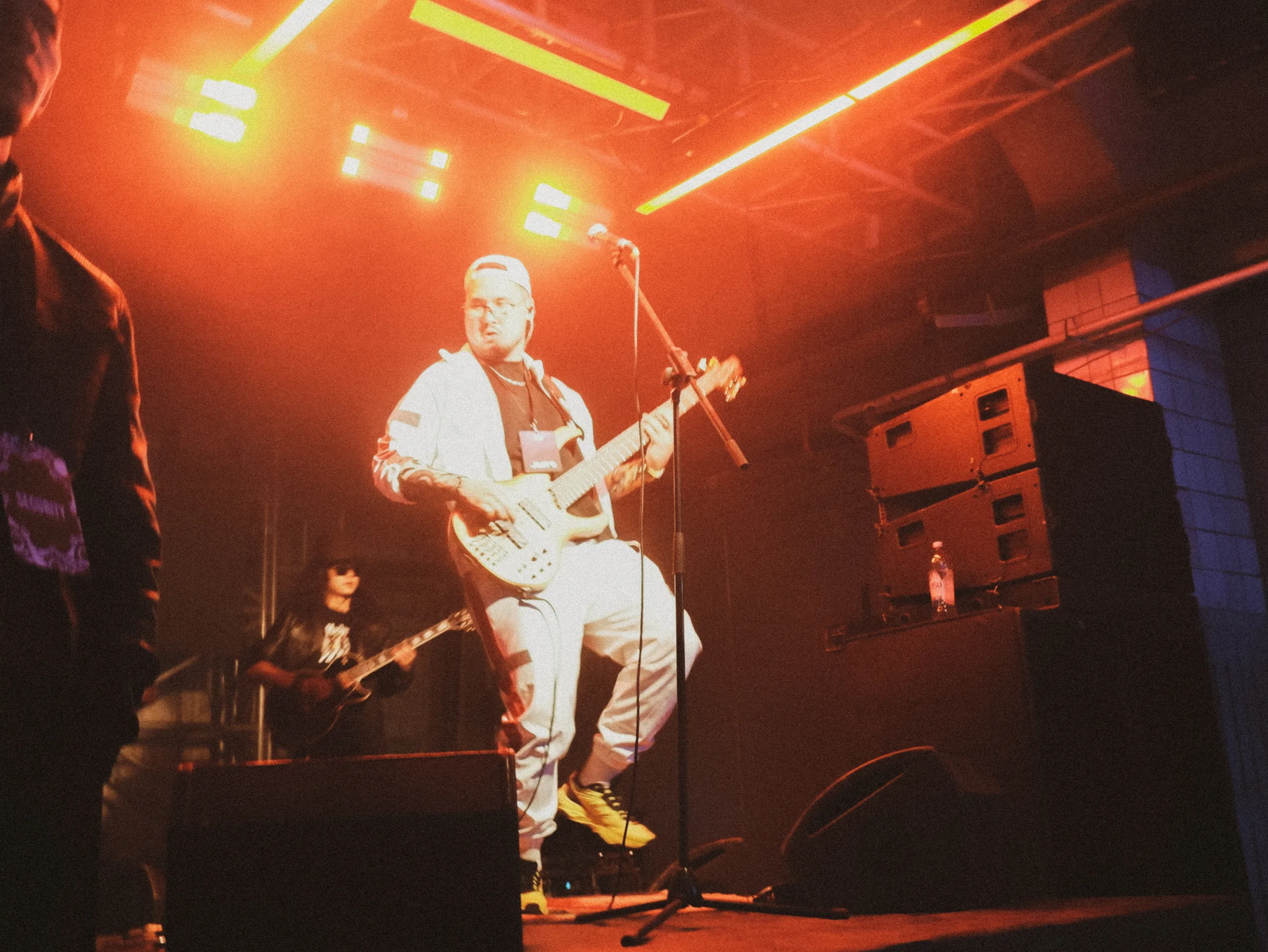 A guitarist in orange light